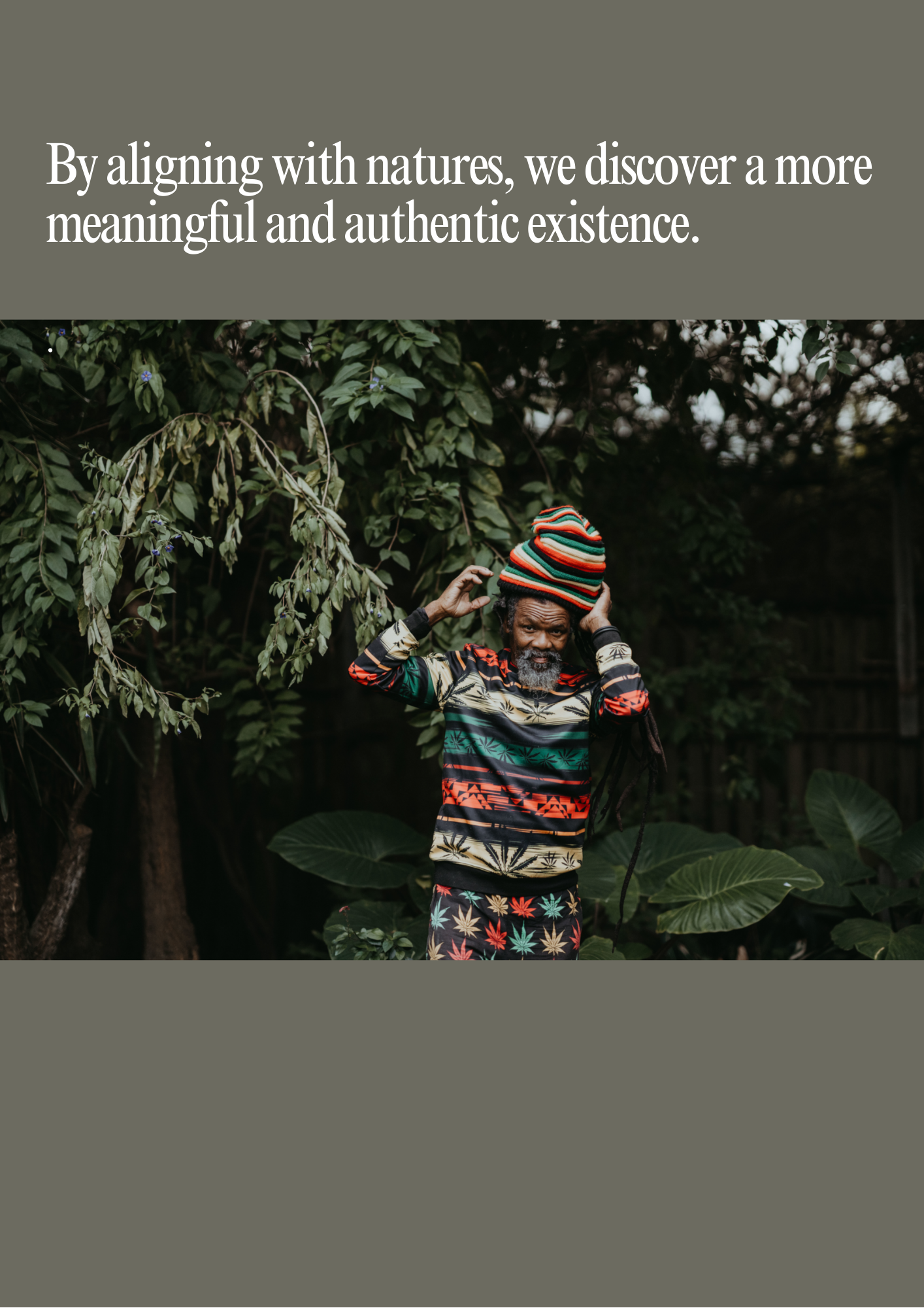 Portrait surrounded by lush greenery representing Akashic Tiles' philosophy of nature-inspired design, conscious craftsmanship and authentic handmade ceramics.