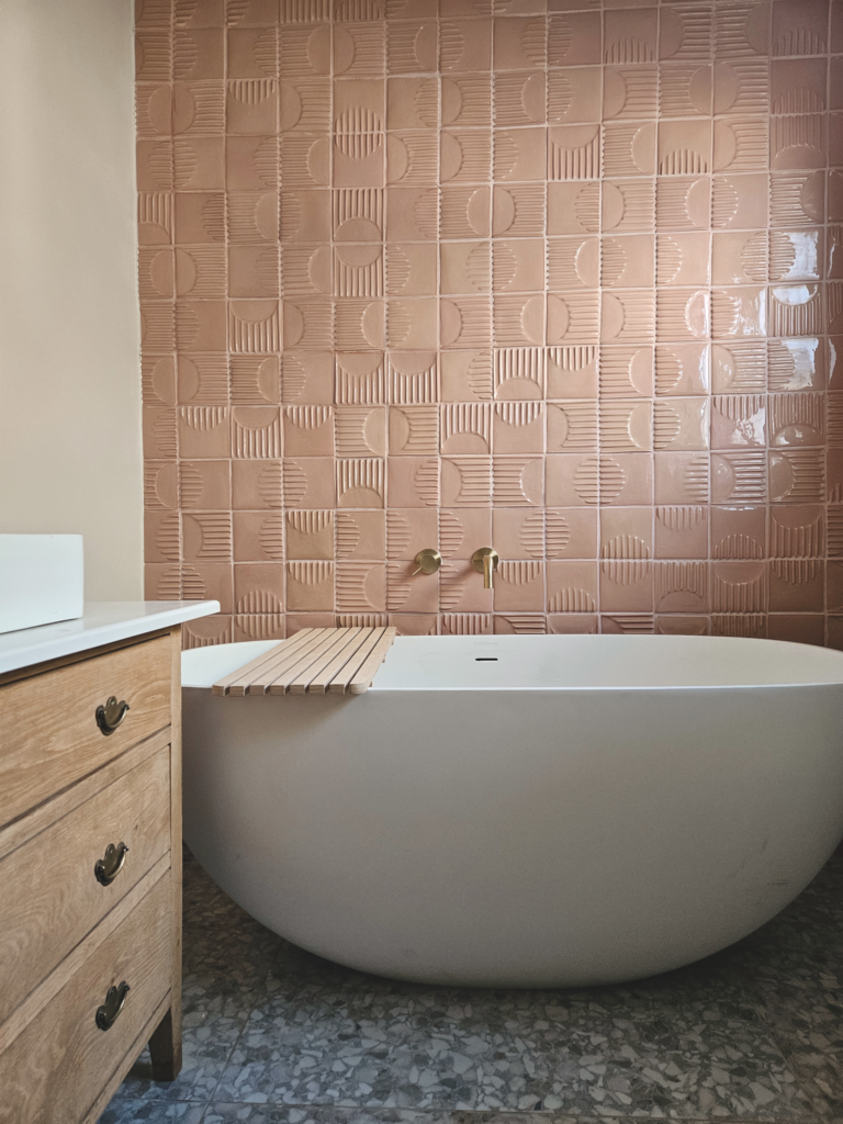 Cement pink Turning Circles handmade wall tiles in a contemporary bathroom